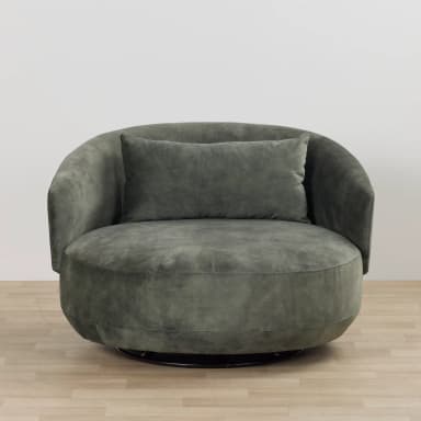 A large, round upholstered swivel lounge chair in a dark gray-green fabric, featuring a continuous curved backrest and integrated arms, with a matching lumbar cushion. — 3D model