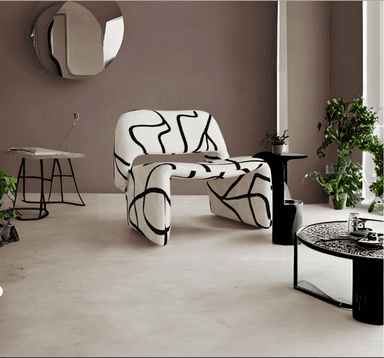 A low-profile, upholstered lounge chair featuring a distinctive, continuous sculptural form. The chair is covered in a cream-colored fabric adorned with a bold, black abstract line pattern. Its design integrates the backrest, seat, and base into one fluid, rounded shape, indicative of contemporary and postmodern aesthetics. — 3D model