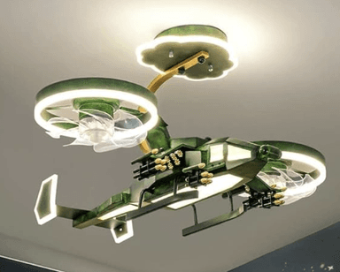 A modern, multi-arm LED chandelier with a distinctive sci-fi or futuristic aesthetic. It features a central angular body in green with gold-colored accents resembling mechanical components or weaponry. Two elongated arms extend horizontally, each ending in a ring of light, with additional translucent elements beneath that suggest thrusters or wings. The fixture is suspended by a golden rod from a scalloped, illuminated ceiling plate. The overall design evokes the appearance of a spaceship or advanced drone, set against a starry background. — 3D model