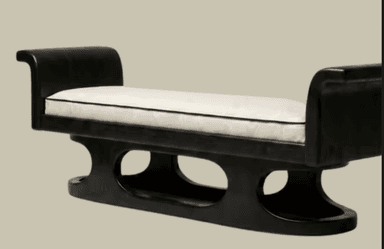 A contemporary bench featuring a dark, possibly black, wooden frame with elegantly rolled armrests and a distinctive sleigh-style base. The bench is topped with a rectangular, white upholstered cushion detailed with black piping along its edges. The base incorporates oval cutouts, adding to its modern aesthetic. — 3D model