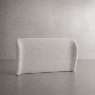 A minimalist, rectangular upholstered panel designed to function as a headboard. It features gently rounded corners at the top and a slight curvature on the side edges, giving it a soft, contemporary aesthetic. The panel is covered in a light beige, textured fabric, likely boucle or a similar woven material, providing a plush, inviting surface. — 3D model