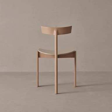 A modern dining chair with a curved backrest and a gently contoured seat. The chair features a wooden frame constructed from light-colored wood. The seat appears to be made of a contrasting material, possibly a molded plastic or a light-colored wood veneer, and is set within the wooden frame. The backrest is also wood and curves upward from a central vertical support. The legs are straight and tapered slightly. — 3D model
