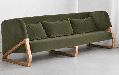 A contemporary three-seater sofa upholstered in a soft green fabric, featuring a distinctive open angular wooden frame that serves as its base and side supports. — 3D model