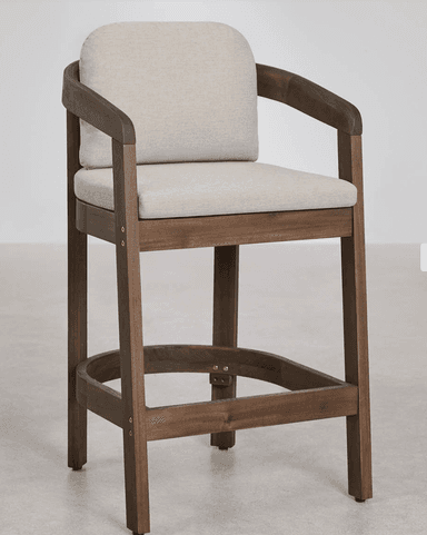 A modern dark brown wooden bar stool with upholstered seat and back cushions in a light beige fabric. It features curved armrests that seamlessly integrate into the back support and frame, along with a square footrest bar for comfort. The design is clean and contemporary. — 3D model