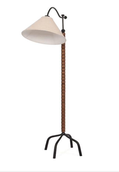 A contemporary floor lamp featuring a light-colored conical fabric shade suspended from a curved black metal arm. The lamp's vertical standard is composed of numerous stacked, dark brown wooden beads, culminating in a three-legged black metal tripod base. — 3D model