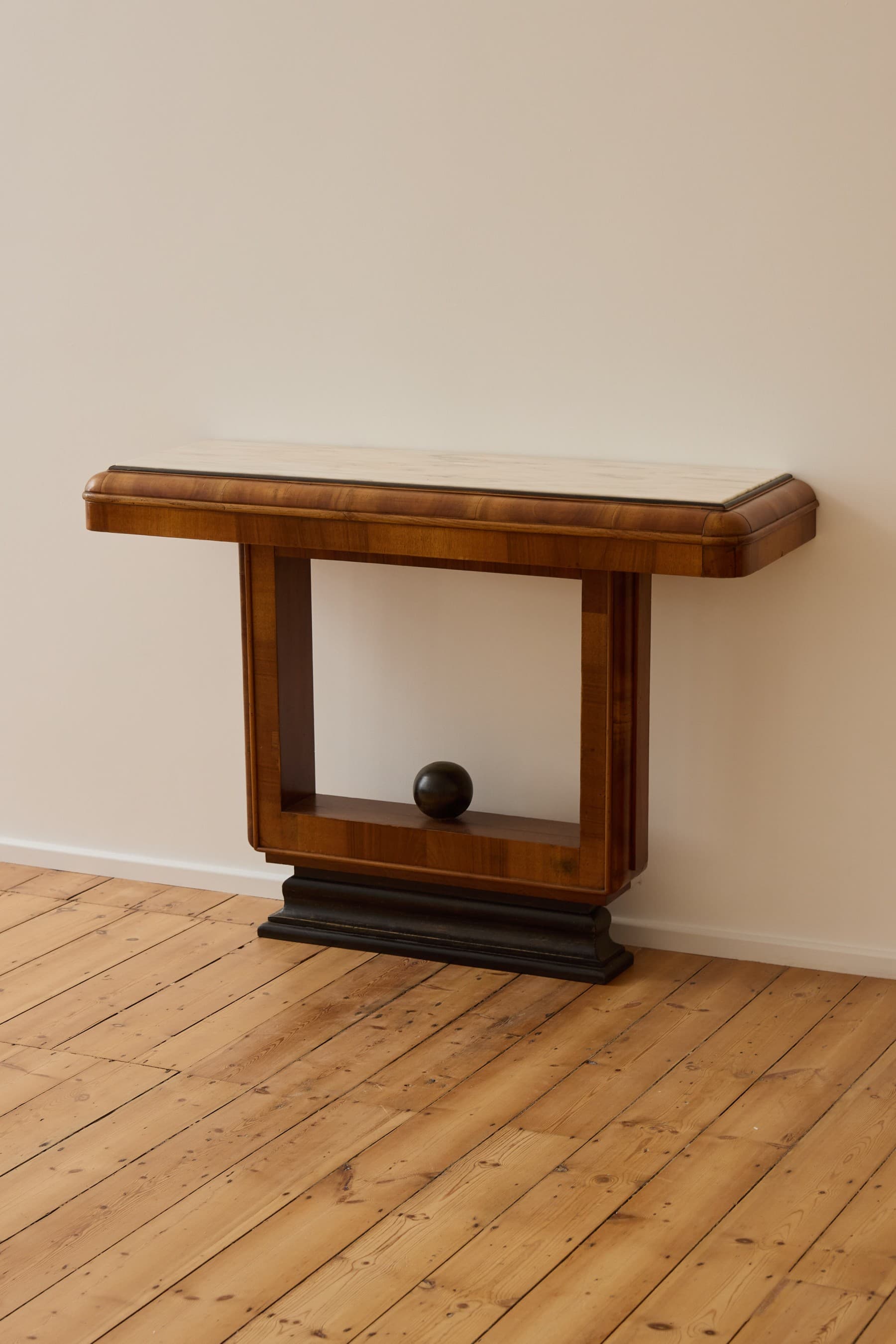 An elegant Art Deco console table featuring a rectangular white marble top and a solid walnut veneer base with a geometric, architectural form and a stepped plinth. — 3D model