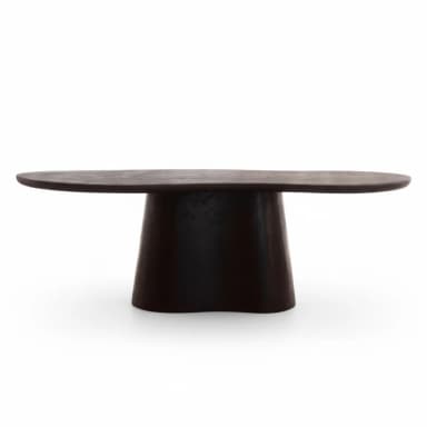 A dark, organic-shaped coffee table featuring a sculptural single pedestal base. The tabletop is irregularly oval/bean-shaped with soft, rounded edges. The base is thick and curvilinear, subtly flaring from the floor and tapering towards the top. The material appears to be dark-toned wood or wood composite with a textured, matte finish. — 3D model