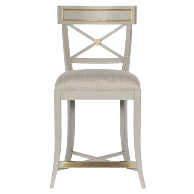 An elegant neoclassical-style counter stool featuring a light grey painted wooden frame with antique gold accents. The backrest has a distinct X-shaped splat with a central medallion, topped by a broad rail with gilded detailing. The seat is upholstered in a light cream fabric, providing comfort. The legs are tapered, and a golden metal footrest bar connects the front legs, while additional stretchers provide stability. — 3D model