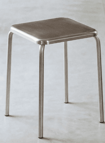 A minimalist square-top stool constructed entirely from brushed metal, featuring four straight tubular legs with rounded edges on the seat and rubber feet caps. — 3D model
