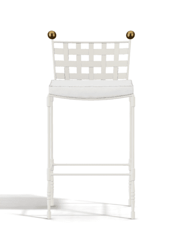 A white bar stool featuring a backrest constructed from wide interwoven straps, a cushioned seat, and decorative brass finials on the back posts. The frame is slender and includes an integrated footrest. — 3D model