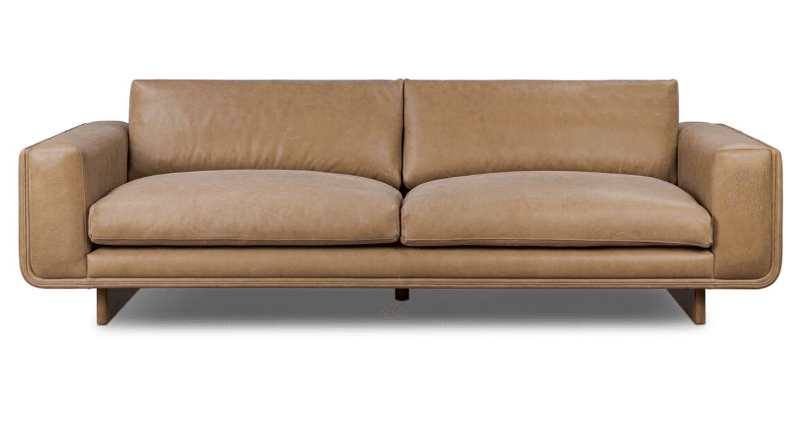 A modern two-seater sofa upholstered in tan leather, featuring clean lines, thick cushions, and subtly rounded arm details, supported by recessed dark wood block legs. — 3D model