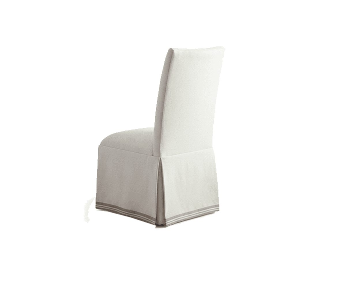A fully upholstered dining chair featuring a removable slipcover in a light, neutral-toned fabric. The slipcover extends to the floor, forming a pleated skirt around the base, and is accented with a horizontal striped detail near the hem. The chair has a clean, somewhat tall backrest and a comfortable, cushioned seat, presenting a relaxed yet refined aesthetic. — 3D model