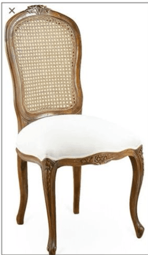 An elegant dining chair in a French Rococo style, featuring a rich brown wooden frame with intricate carvings. The backrest is gently curved, incorporating a woven cane panel for a light, airy aesthetic. The seat is upholstered in a plain white fabric, providing a clean contrast to the ornate frame. The chair stands on gracefully curved cabriole legs, characteristic of the Rococo period, with additional carving details on the seat rail. — 3D model
