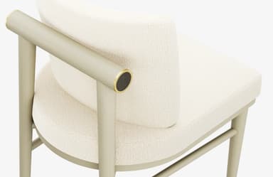 An armless dining chair featuring a fully upholstered seat and backrest in a textured, light cream boucle fabric. The frame is constructed from wood with a light sage green or greige finish, featuring gently tapered legs and stretchers for stability. A distinct cylindrical brass-toned metal accent is integrated into the upper part of one of the rear leg supports. — 3D model