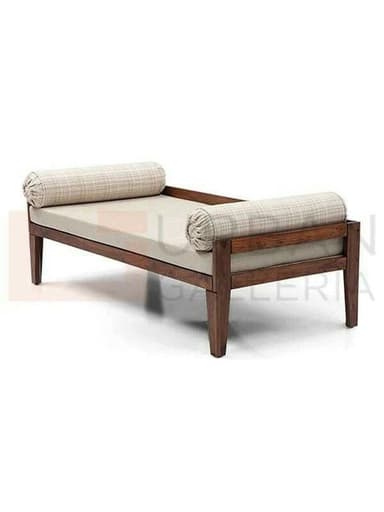 A contemporary daybed featuring a dark-stained solid wood frame, a light beige main cushion, and two patterned cylindrical bolster pillows at either end. The frame has clean lines and sturdy, tapered legs. — 3D model