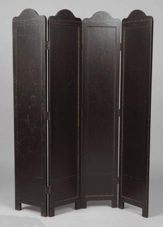 A four-panel folding screen, dark brown in color, with a distressed finish. Each panel is rectangular with a scalloped top edge. The panels are joined by visible metal hinges, suggesting they can be folded for storage or to change configuration. The surface shows some wear, including scuffs and lighter markings, particularly on the front panels. It appears to be constructed from wood or a wood composite. — 3D model