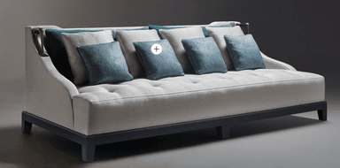 An elegant contemporary daybed featuring a light grey upholstered frame with a low back and integrated side panels, accented with decorative brass-toned metal pieces. The deep seat is button-tufted and accompanied by a set of varying sized bolster and throw cushions in teal and light grey, providing comfortable back support. It rests on a dark, geometric wooden base with block feet. — 3D model
