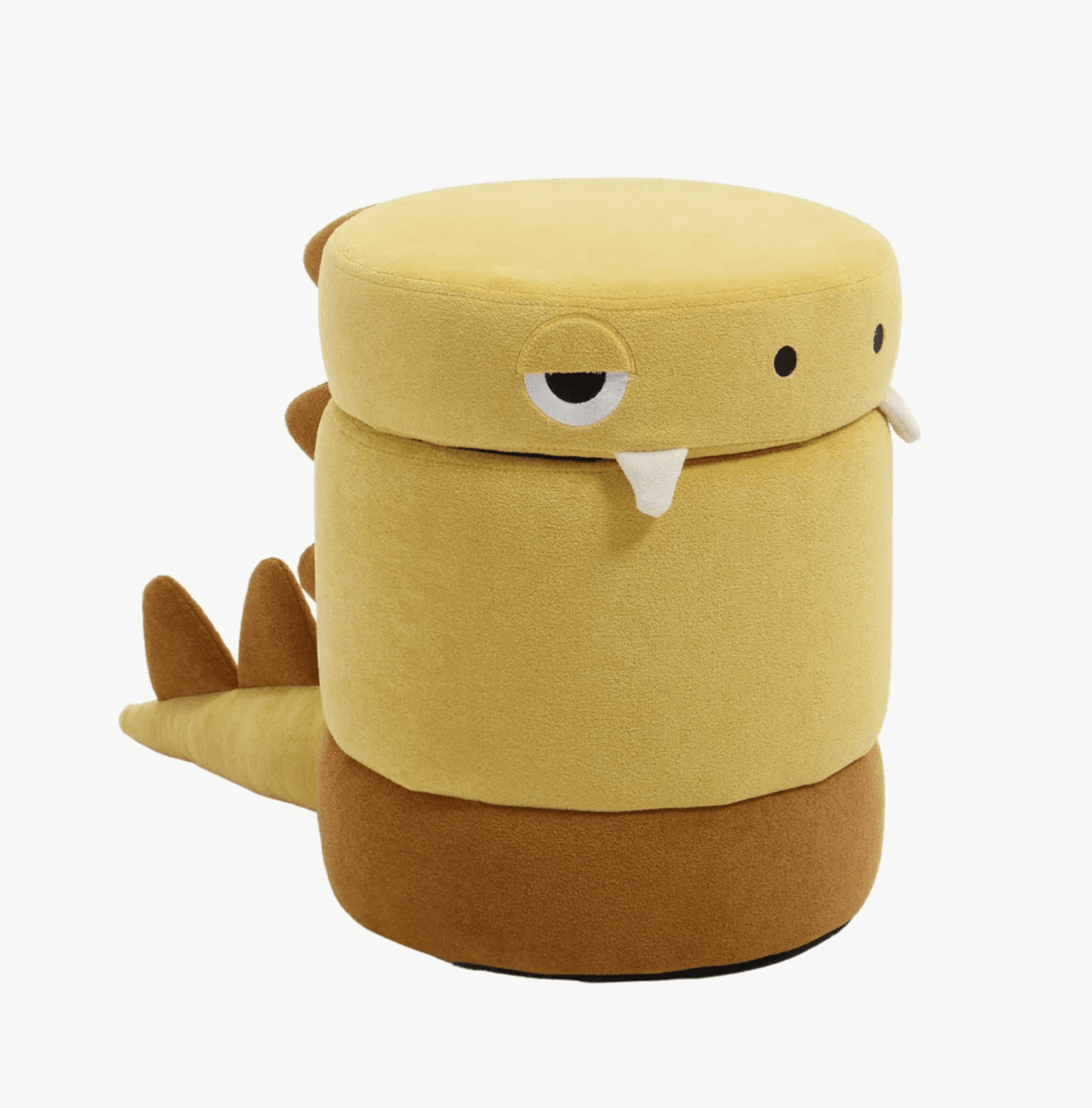 A cylindrical upholstered ottoman designed in the likeness of a dinosaur or monster character. It features a predominantly yellow body with a brown base and includes distinct character elements such as pointed horns, an eye with a drooping lid, fangs, a tail, and dorsal spikes, all rendered in soft fabric. — 3D model