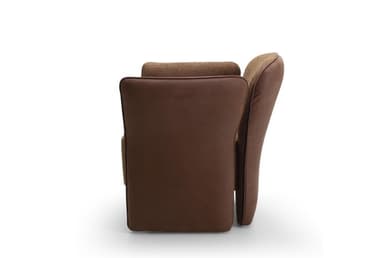 A contemporary upholstered armchair featuring a rounded backrest and integrated armrests that flow down to form the base. The chair is predominantly covered in a textured brown fabric, likely a tweed or boucle. The outer panels of the armrests, from the top down to the floor, are finished in a smoother, slightly darker brown material, possibly faux leather or a contrasting plain fabric, creating a subtle two-tone effect. The design emphasizes comfort with its soft curves and plush appearance, without visible legs. — 3D model