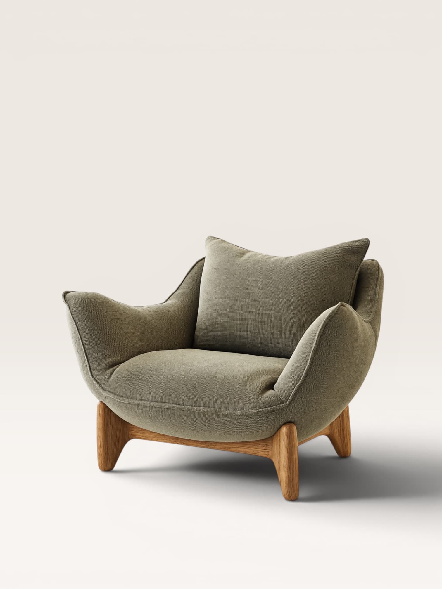 A contemporary lounge chair featuring deep, plush upholstery in a sage green fabric, supported by a sculpted natural wood base and splayed legs. It includes a loose back cushion for added comfort. — 3D model