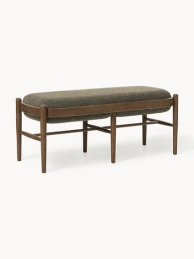 A rectangular upholstered ottoman featuring a solid wooden frame with rounded edges and four tapered legs. The top is generously padded and covered in a textured, greenish-brown fabric, while horizontal wooden stretchers provide structural support. — 3D model