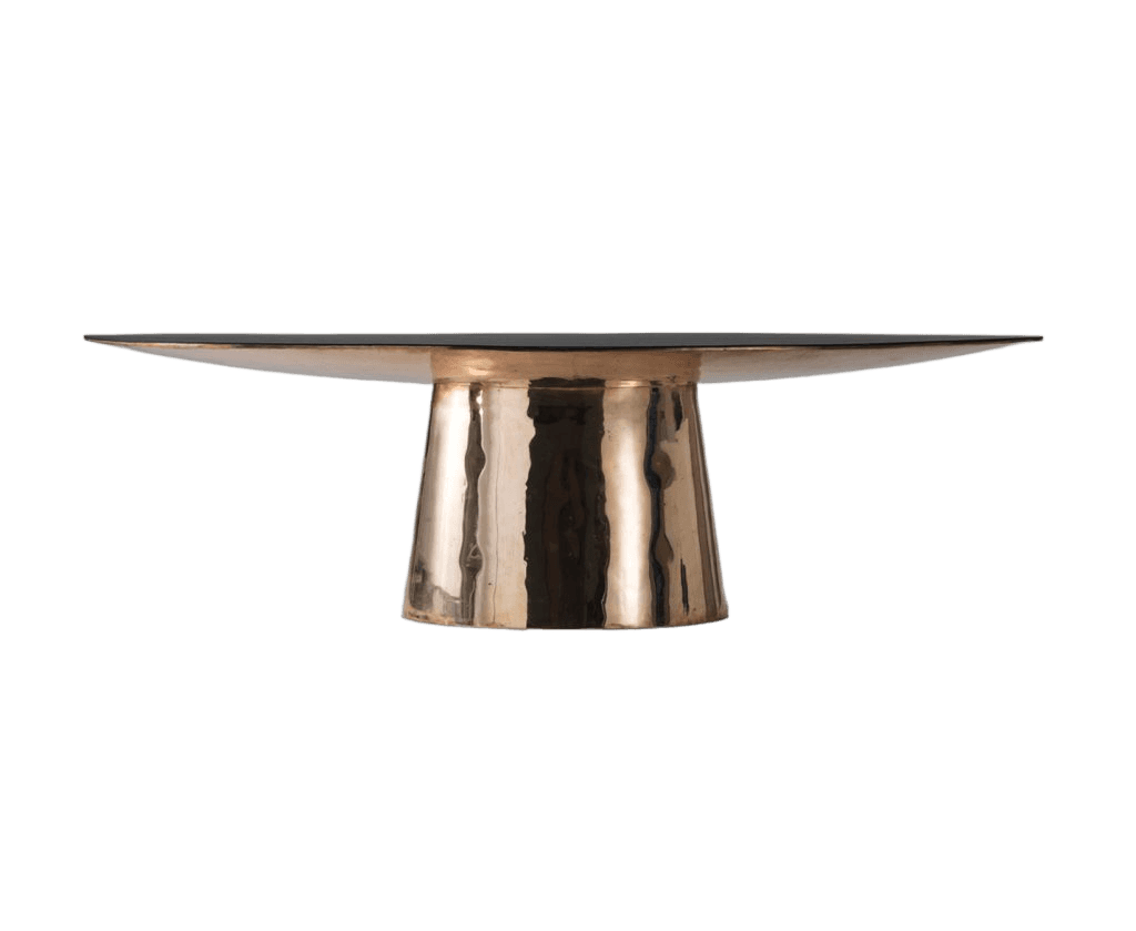 A contemporary coffee table with a distinctive design. It features a wide, thin, dark-colored top that tapers to a sharp edge, supported by a robust, flared pedestal base with a hammered metallic finish. The pedestal has a trapezoidal cross-section, wider at the top where it meets the tabletop and narrowing towards the bottom. — 3D model