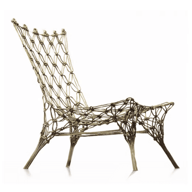 An organically shaped lounge chair constructed entirely from intricately knotted cords or rope, forming both the seat, backrest, and integrated legs. It features an open-weave design. — 3D model
