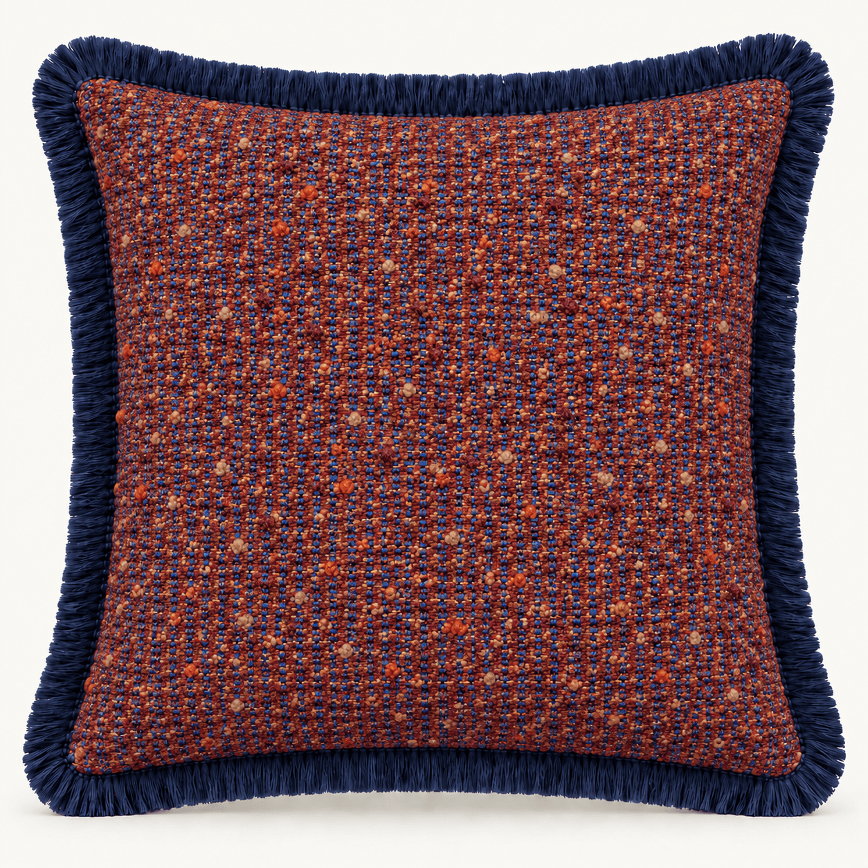 A square throw pillow featuring a textured tweed fabric in a mix of terracotta red and navy blue hues, finished with a navy blue fringe trim along all four edges. — 3D model