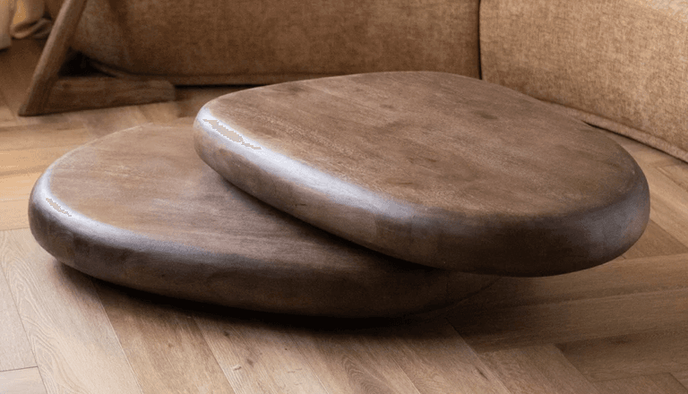 A pair of stacking coffee tables with organically shaped, rounded tops and a dark wood finish. The tables have a minimalist, modern aesthetic. — 3D model