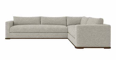An L-shaped sectional sofa featuring light-colored, textured upholstery and a visible wooden plinth base. The sofa has clean lines, box-style arms, and loose back cushions. It is designed for multi-person seating and has a contemporary aesthetic. — 3D model