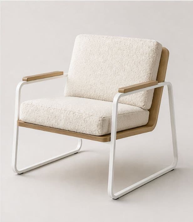 A modern armchair featuring a tubular metal frame in white, supporting a seat and back cushion upholstered in a textured, off-white fabric. The armrests are capped with light-colored wood, and the base incorporates curved wooden elements. — 3D model