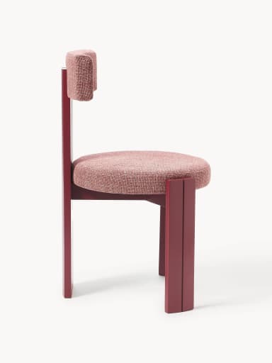 A modern chair with a rectangular seat and a distinctively shaped backrest. The frame and legs are constructed from a solid material, likely wood or metal, finished in a deep red hue. The seat and backrest are upholstered with a textured, reddish-pink fabric. The design features clean lines and a geometric aesthetic. — 3D model