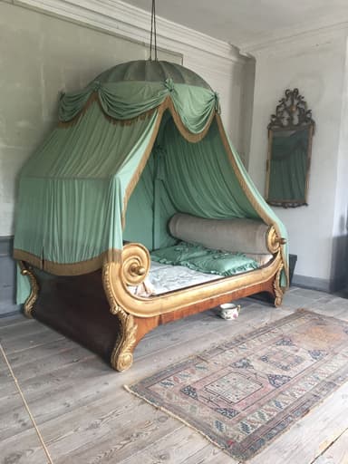 An opulent Empire-style daybed featuring a dark wood base with extensive gilded scrollwork, topped with a suspended pleated mint green canopy and matching upholstery. — 3D model
