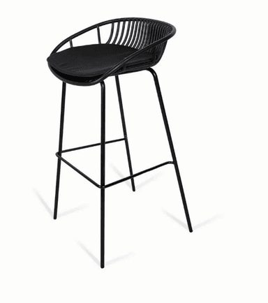 A contemporary bar stool featuring a black powder-coated metal wireframe bucket seat and backrest, paired with a fitted black padded seat cushion. The stool stands on four slender, tapered metal legs with integrated footrests, all finished in a matching matte black. — 3D model