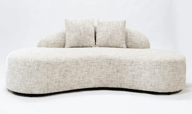 A modern, upholstered sofa with a distinctive curved silhouette. It features a low profile and a flowing, organic shape. The sofa is covered in a textured, neutral-toned fabric and includes two matching throw pillows. The base appears to be dark and slightly recessed. — 3D model