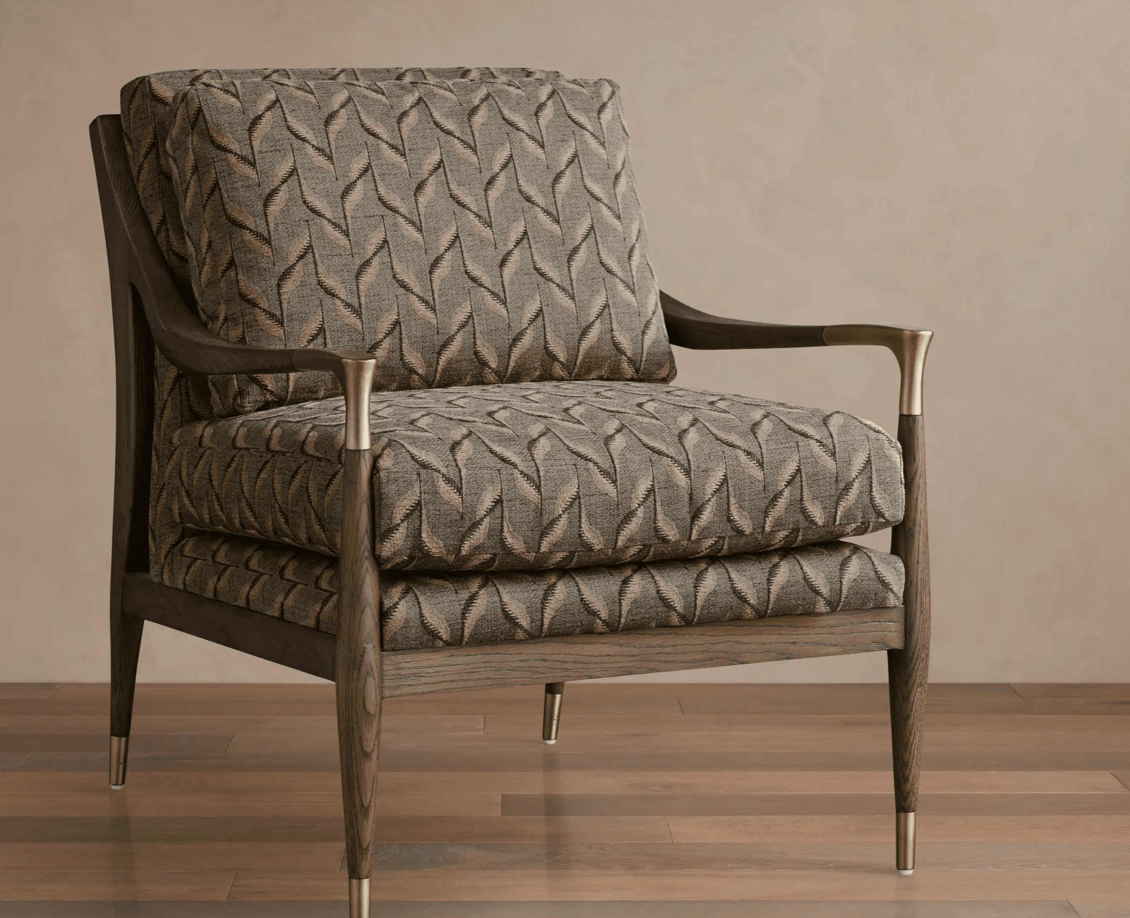 A sophisticated lounge chair featuring an exposed dark-stained wooden frame with a distinct geometric upholstered pattern. The chair has two substantial loose cushions for the seat and back, providing comfort. The armrests are elegantly curved wood, capped with brass details where they meet the front legs. The tapered wooden legs are also finished with subtle brass ferrules, adding a touch of metallic accent to the overall design. — 3D model
