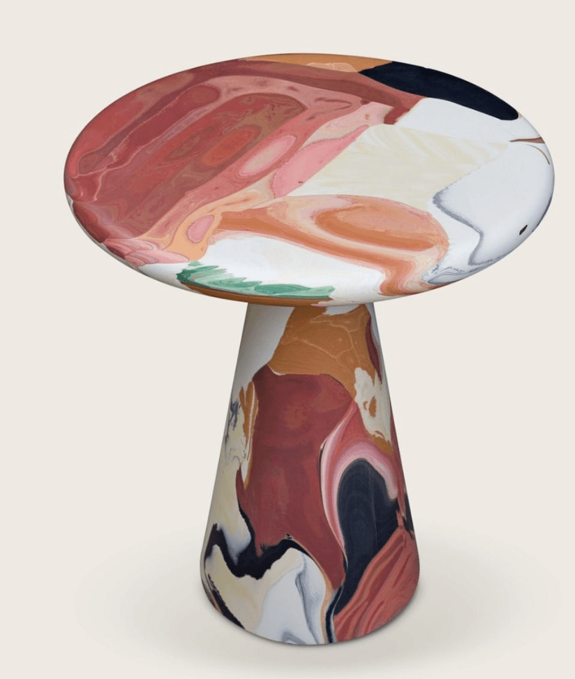 A side table with a round, flat top and a conical base. The surface features a marbled or fluid art pattern with a mix of earthy tones, white, pink, and black. — 3D model
