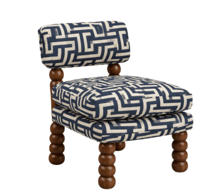 An armless upholstered chair featuring a short backrest and distinctive turned bobbin legs, adorned with a bold geometric maze pattern in navy blue and off-white. — 3D model