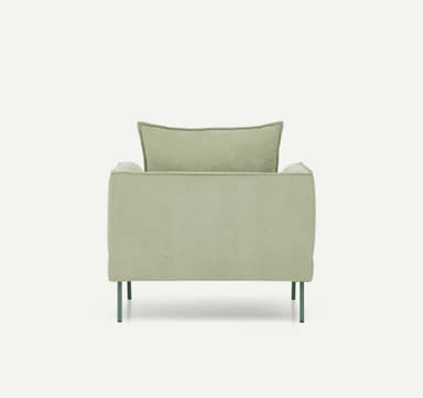 A contemporary upholstered armchair featuring a soft, muted sage green fabric, loose seat and back cushions, and slender, complementary dark green metal legs. — 3D model