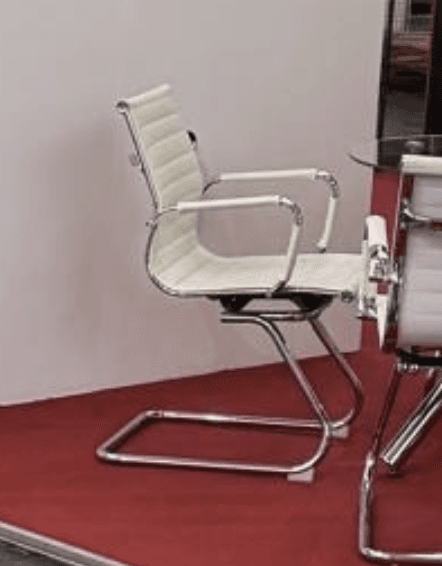 A modern white ribbed armchair featuring a distinctive sled base and integrated armrests, rendered against a plain white background. The chair has a minimalist aesthetic, with horizontal ribs on both the seat and backrest providing texture and a streamlined appearance. The frame and armrests are constructed from polished chrome-plated metal, creating a sleek contrast with the white upholstery. — 3D model