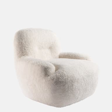 A plush, off-white upholstered lounge chair with a rounded, inviting silhouette, covered in a thick, textured material resembling sheepskin or boucle. — 3D model