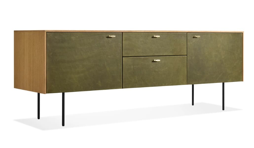 A long, low credenza with a wooden frame and front panels. The left side panel appears to be made of wood, while the central and right panels are covered in a textured, olive-green material, possibly leather or a treated fabric. It features two drawers stacked vertically in the center and two cabinet doors, one to the left and one to the right of the drawers. Each drawer and door has a small, rectangular metallic handle. The credenza is supported by four thin, black, cylindrical legs. — 3D model