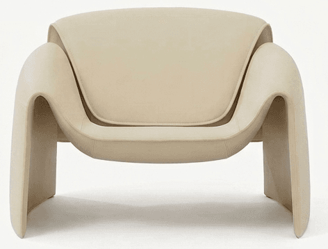 A cream-colored, contemporary lounge chair characterized by its smooth, sculptural form and thick, upholstered construction. The chair features integrated armrests and legs that curve seamlessly from the main body, creating a monolithic aesthetic. It includes distinct, recessed seat and back cushions for comfort, maintaining a minimalist and organic modern design. — 3D model