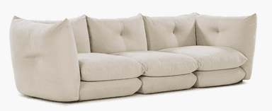 A three-seat sofa with a modular appearance, featuring deep, plush cushions and rounded arms. The back cushions are slightly tufted, and the overall design has a contemporary, comfortable aesthetic. The sofa sits low to the ground with a minimal base. — 3D model