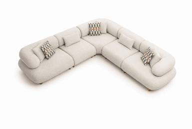 A cream-colored, modular sectional sofa with rounded edges and a low profile, arranged in an L-shape, accompanied by matching and patterned throw pillows. — 3D model