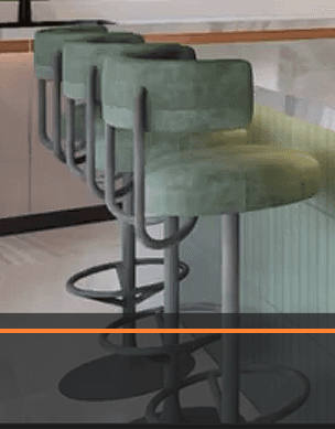 A modern bar stool featuring a circular upholstered seat and a curved, low backrest. The upholstery is a sage green or grey-green textured fabric. The stool stands on a dark gray metal pedestal base with an integrated circular footrest and a round disc footplate. — 3D model