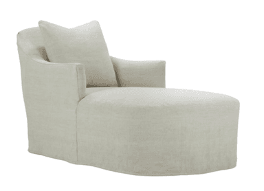 A contemporary chaise lounge featuring a fully upholstered body in a light-colored fabric. It includes a single loose back cushion and wide, slightly sloped armrests, with a relaxed skirted base extending to the floor. — 3D model