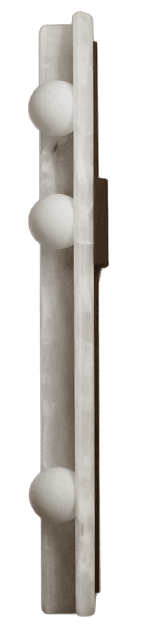 A modern wall-mounted lighting fixture featuring a tall, rectangular panel of translucent, veined white onyx. Three evenly spaced spherical white light diffusers protrude from the central front surface of the onyx slab. A dark, likely metallic, mounting plate is visible from the side, providing a subtle contrast to the luminous stone. — 3D model