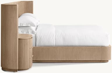 A contemporary wooden bed frame with an integrated headboard and side cabinets. The headboard is a large, vertically slatted panel that extends the full width of the bed and continues upwards. Attached to either side of the headboard are curved side panels. Built into the base of the bed frame and extending from underneath the headboard are two matching cabinets, each featuring three drawers with integrated pulls. The bed is dressed with white bedding, including two pillows. — 3D model