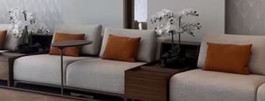 A modern modular sectional sofa featuring light-colored fabric upholstery, integrated dark wood tables, and burnt orange accent cushions, presented against a white background. — 3D model